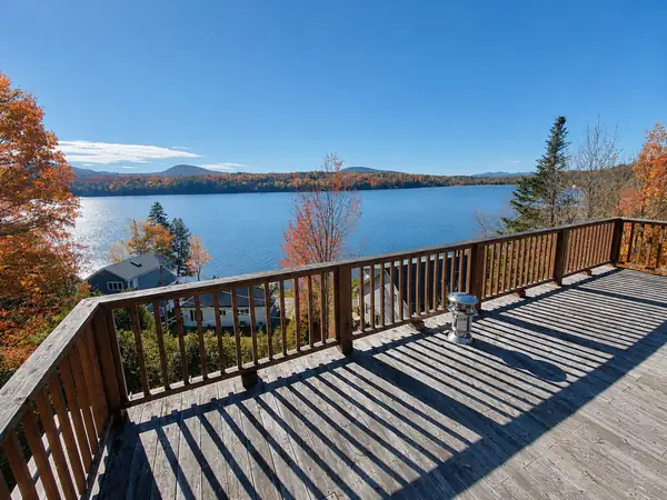 Deck and lake views during peak Vermont fall foliage
