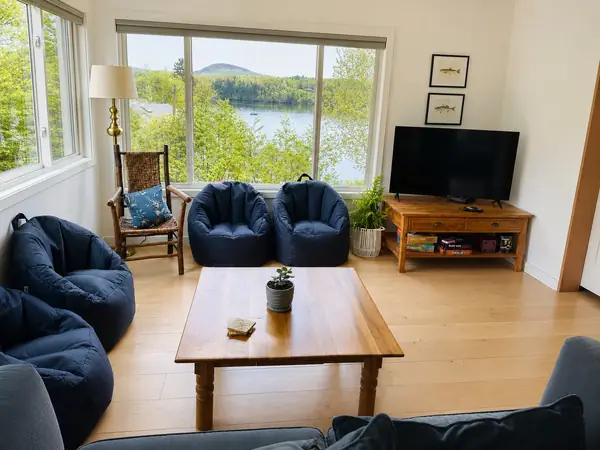 Bean bag lounge and coffee table with the lake straight ahead