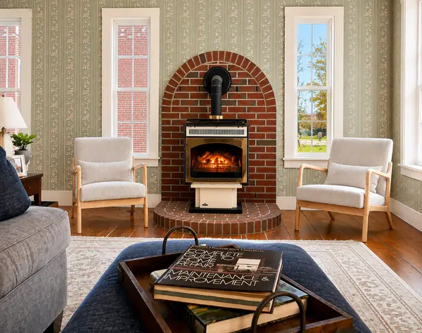 Living room with brick fireplace and Adirondack-style chairs