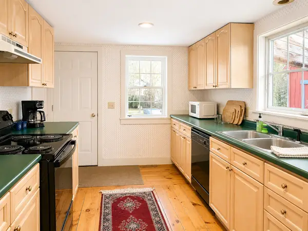 Kitchen with butcher-block counters and bright window