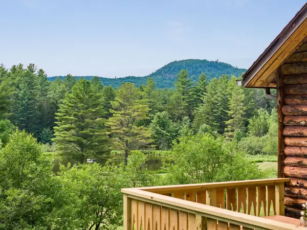 Cabin exterior with mountain backdrop
