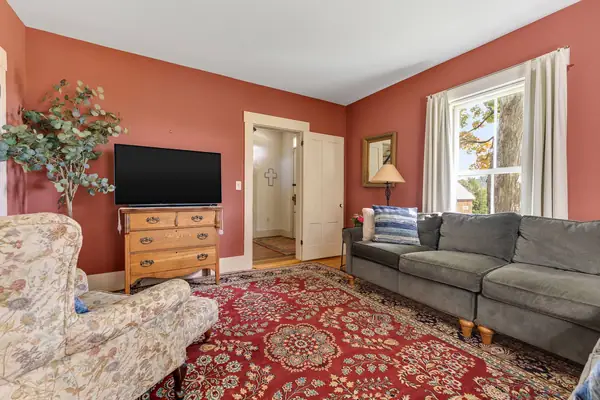 Living room with TV and armchairs