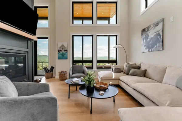 Living room seating area facing the mountain view windows