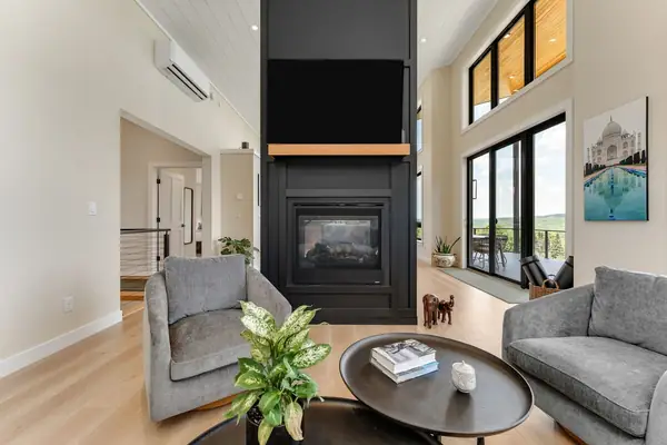 Armchairs beside the gas fireplace in the living room