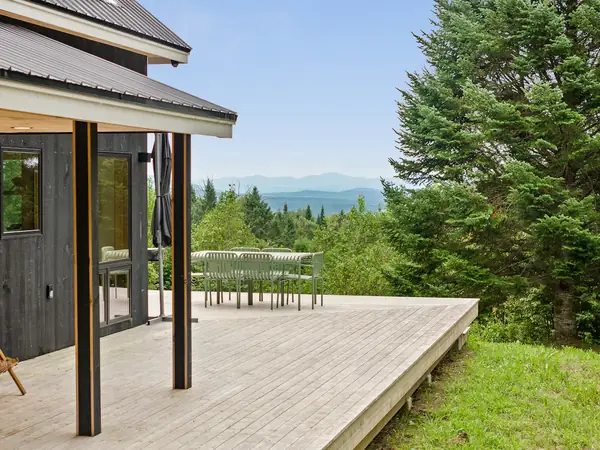 Wraparound deck with sweeping views over the valley
