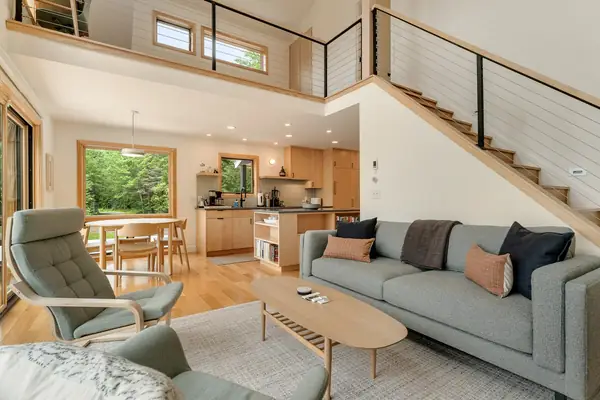 Living room with open stairs to the loft
